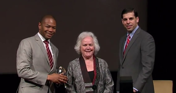 Photo of Ted Corbin, MD, MPP accepting an award from the National Office for Victims of Crime